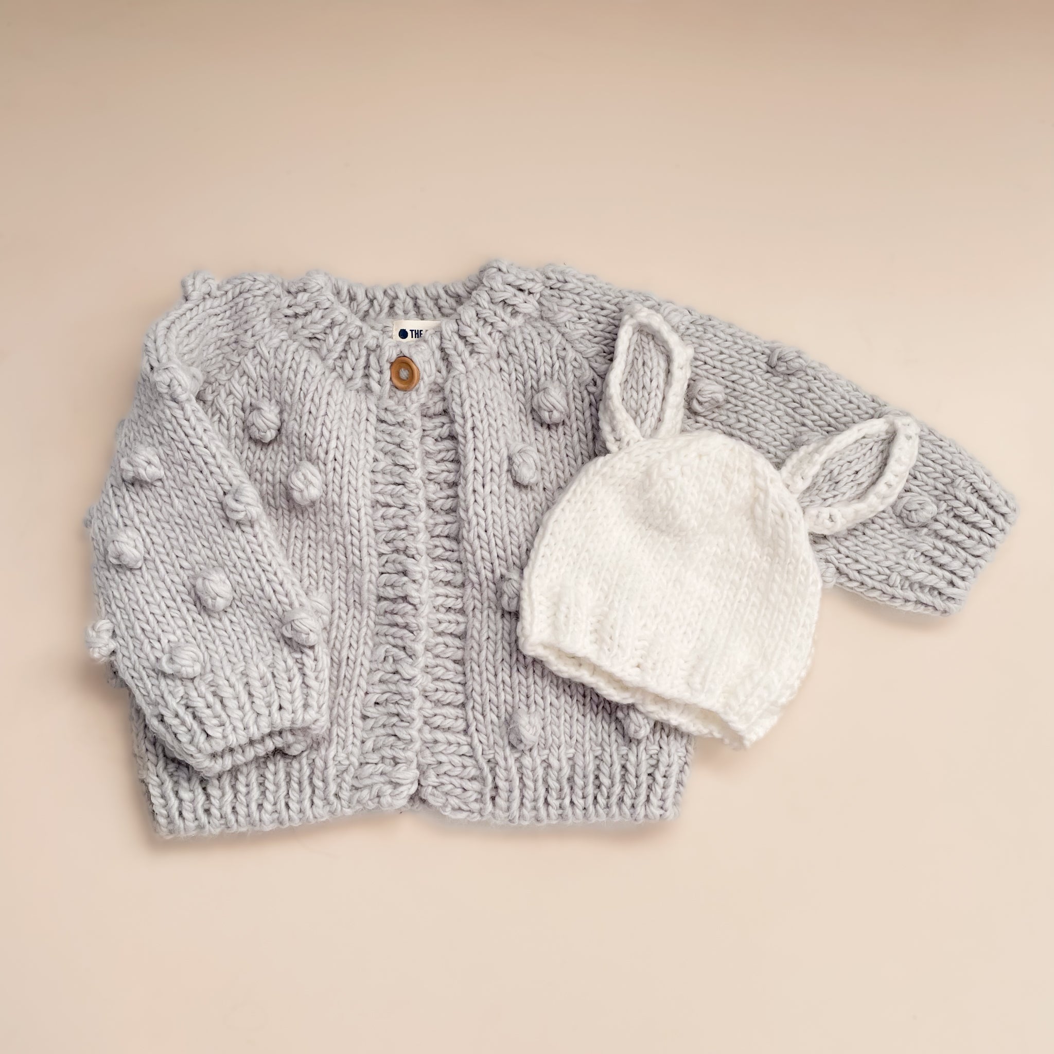 Grey knitted baby cardigan hotsell