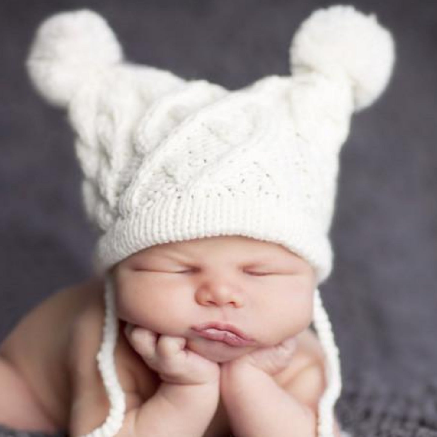 cable knit hat for baby with poms and tassels cream