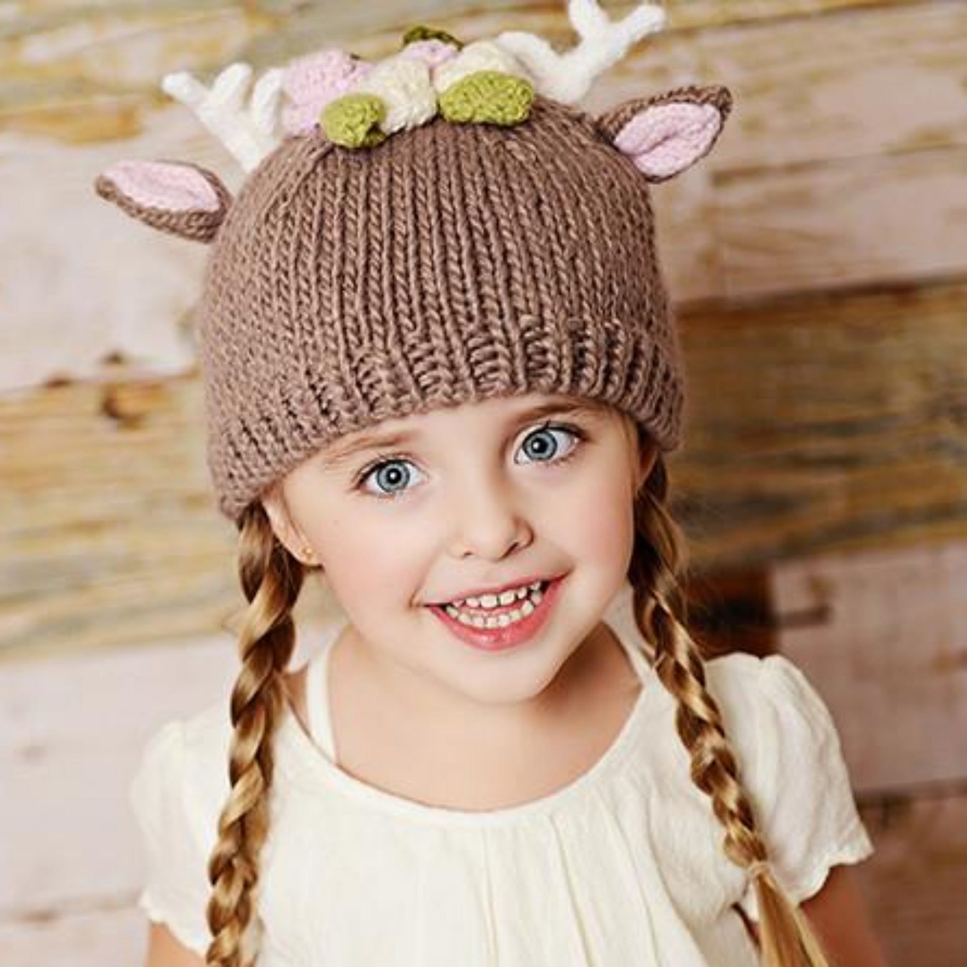 hand knit tan deer hat with pink ears and white antlers and flowers for baby infant toddler child christmas winter holiday