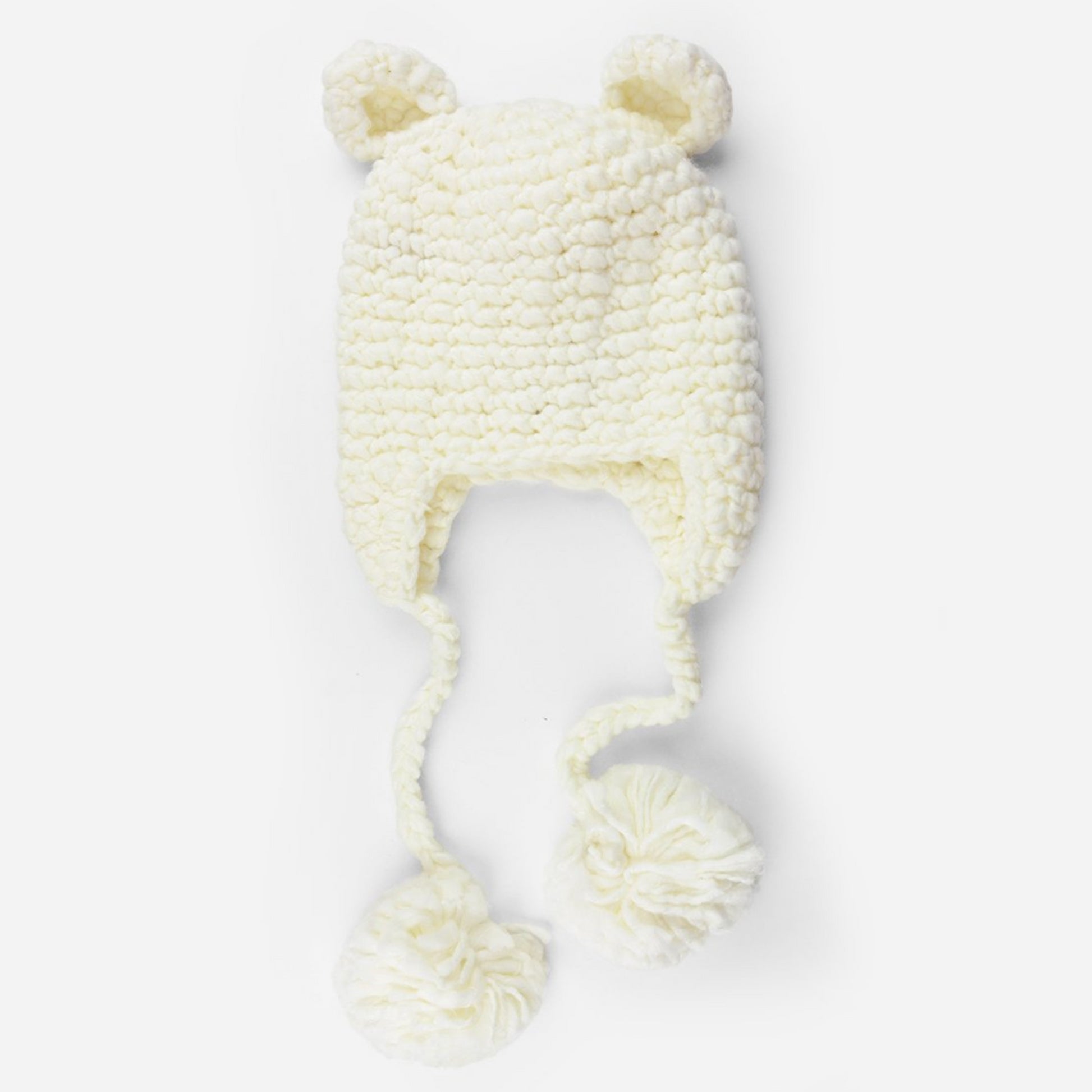 crochet bear hat with ears and pom tassels for baby and toddler cream